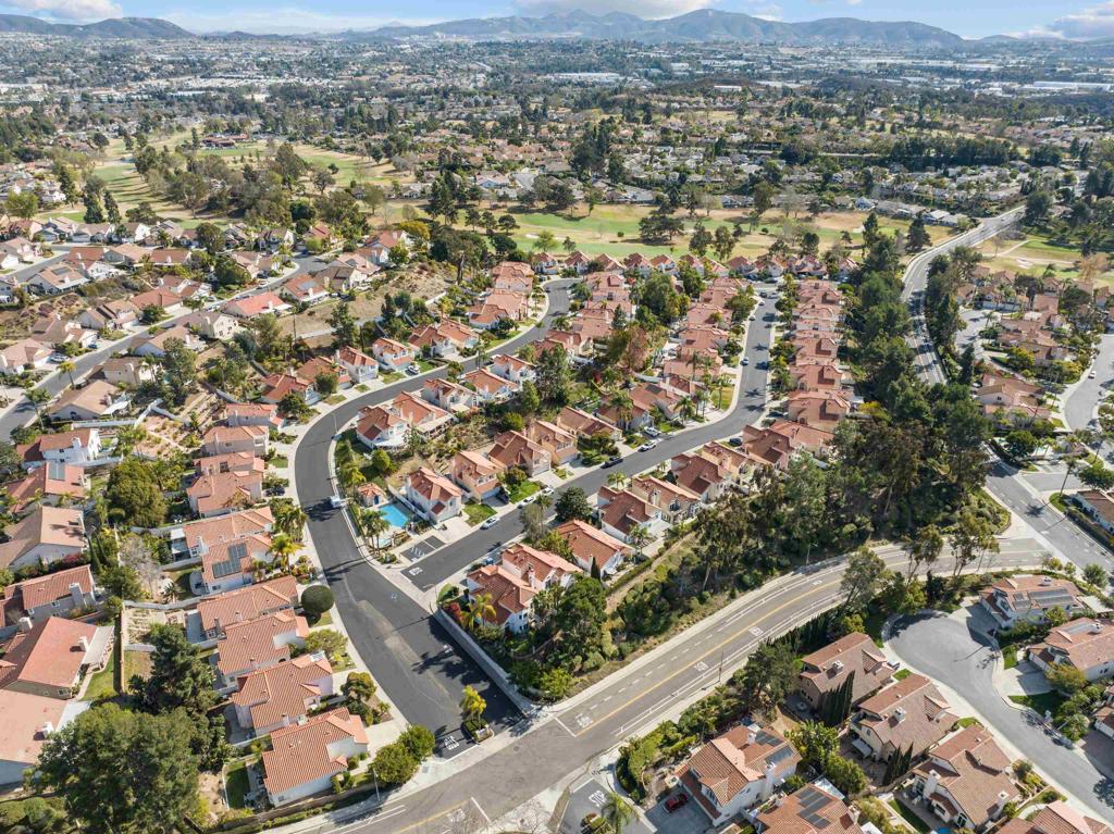 1453 Genoa Drive Vista, CA 92081 - Photo 30 of 32 an aerial view of residential houses with outdoor space