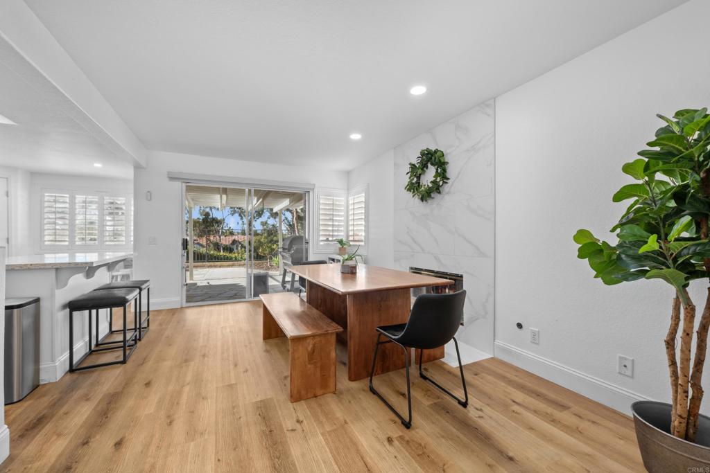1453 Genoa Drive Vista, CA 92081 - Photo 7 of 32 a view of a dining room with furniture window and wooden floor