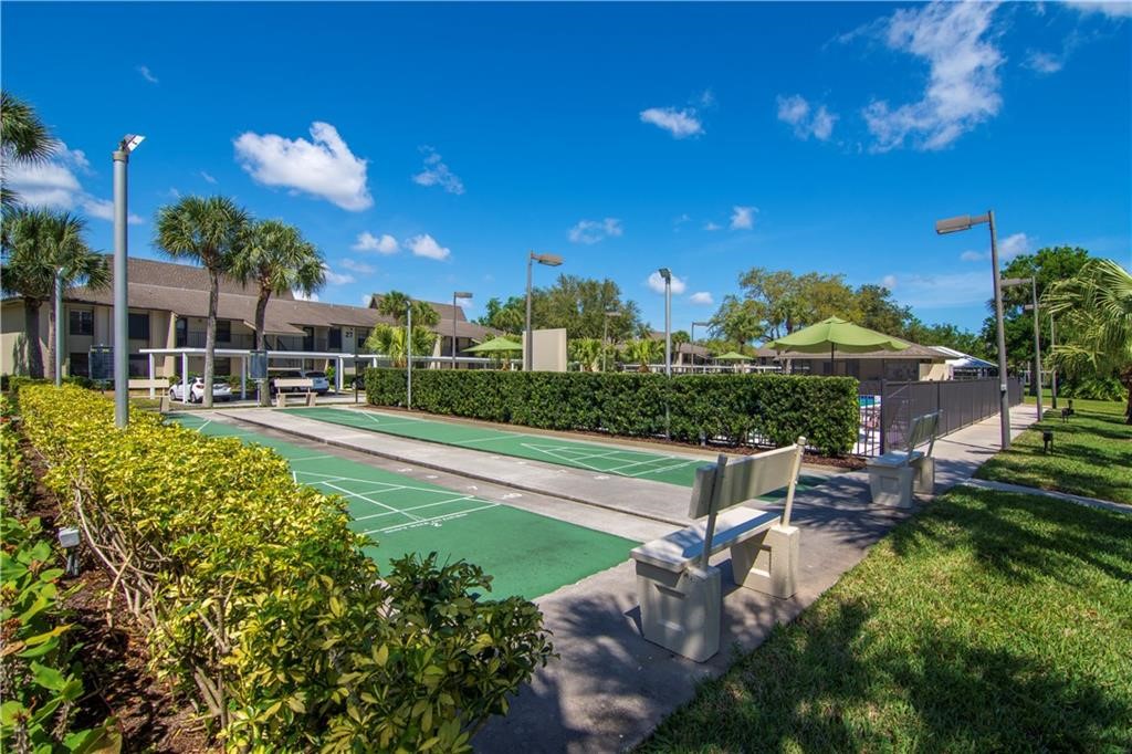 27 Plantation Drive, Unit 202 Vero Beach, FL 32966 - Photo 15 of 30 a view of a swimming pool with a patio