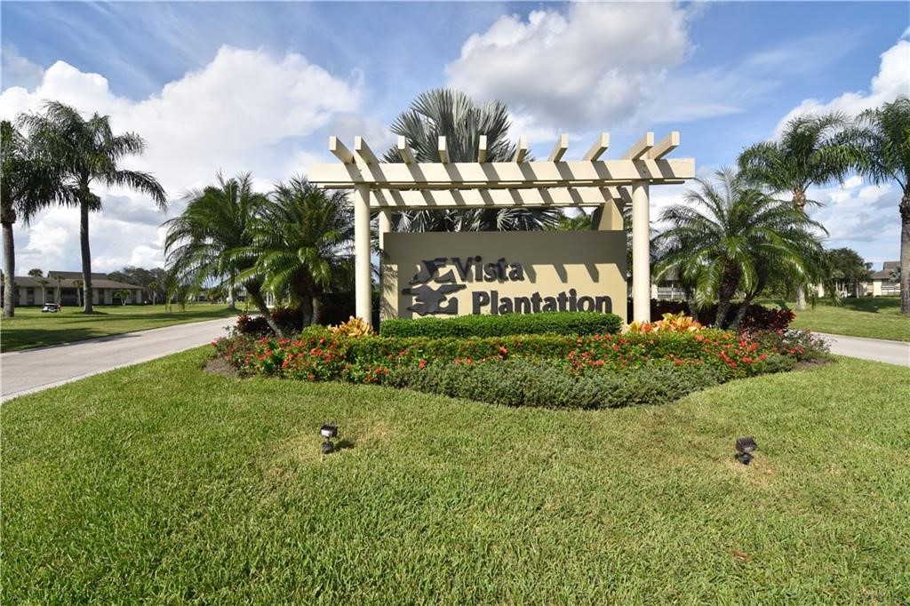 27 Plantation Drive, Unit 202 Vero Beach, FL 32966 - Photo 28 of 30 a view of a park with palm trees