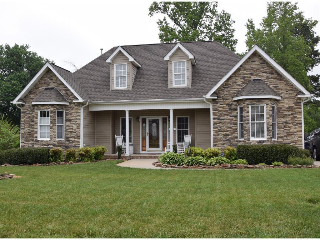 1817 Eric Graham, NC 27253 - Photo 1 of 24 a front view of a house with a yard