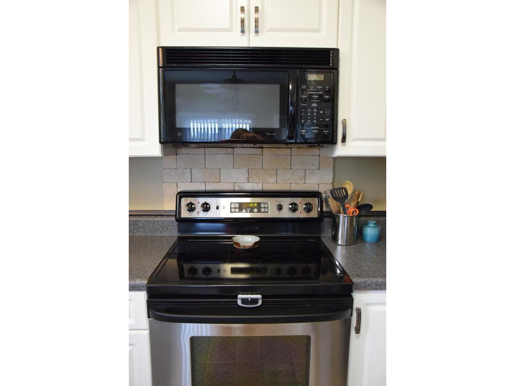 1817 Eric Graham, NC 27253 - Photo 12 of 24 a stove top oven sitting inside of a kitchen