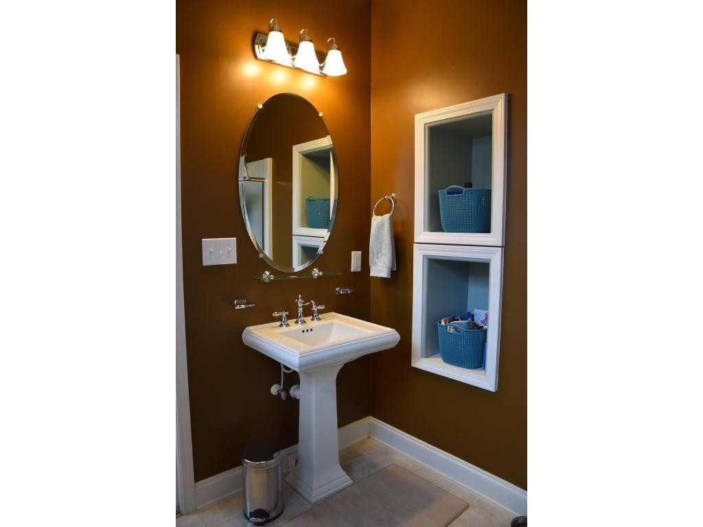 1817 Eric Graham, NC 27253 - Photo 17 of 24 a bathroom with a sink and a mirror