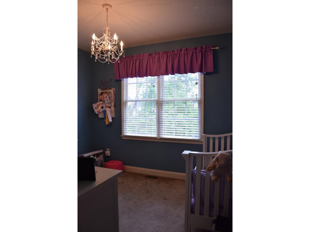 1817 Eric Graham, NC 27253 - Photo 19 of 24 a living room with furniture and a chandelier