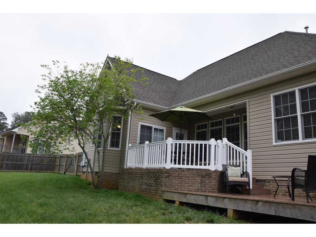 1817 Eric Graham, NC 27253 - Photo 3 of 24 a view of a deck with a yard