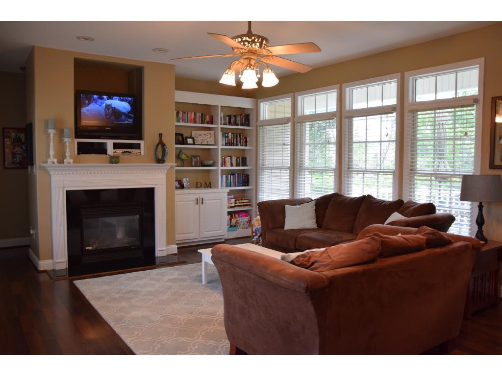 1817 Eric Graham, NC 27253 - Photo 5 of 24 a living room with furniture a fireplace and a flat screen tv