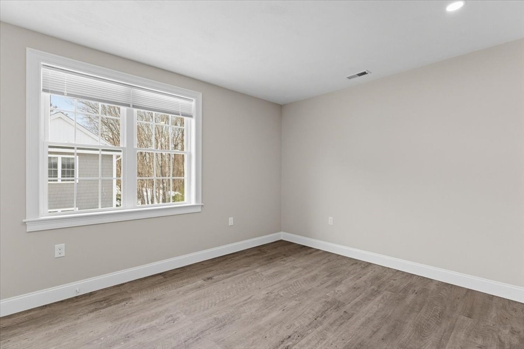 202 Central Street, Unit I Avon, MA 02322 - Photo 14 of 19 an empty room with a window