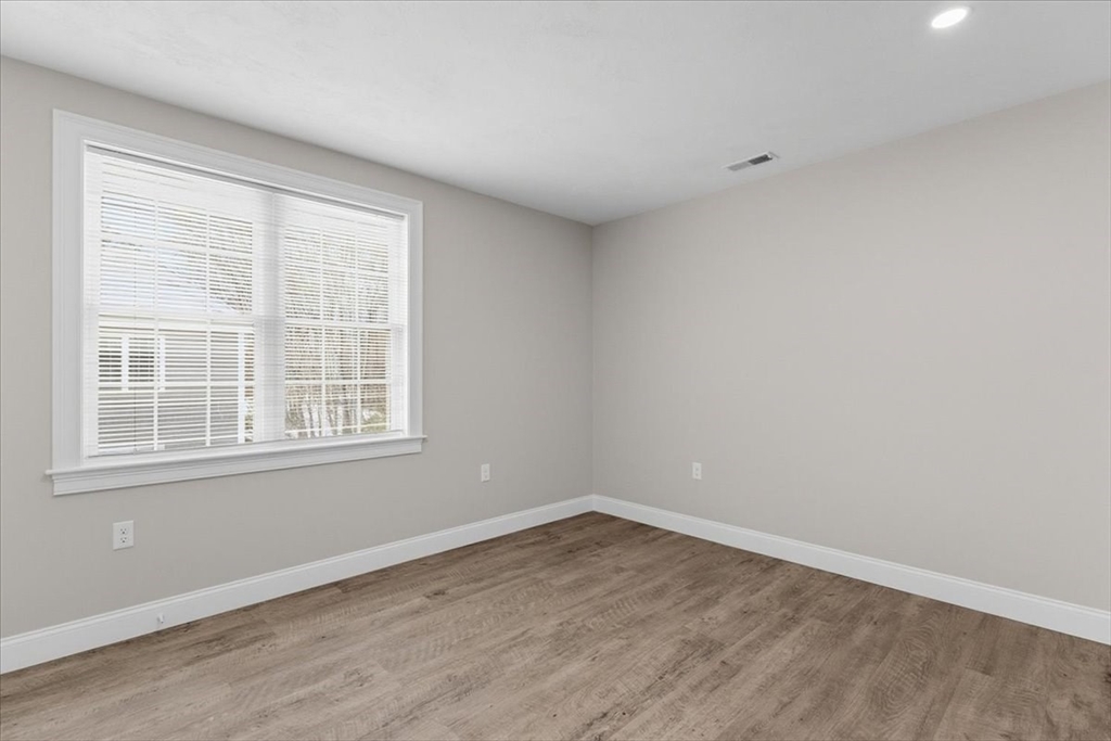 202 Central Street, Unit I Avon, MA 02322 - Photo 16 of 19 an empty room with a window