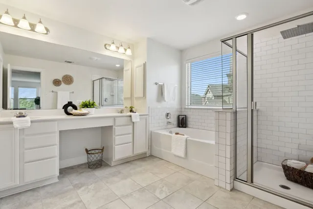 a bathroom with a sink a tub and a mirror