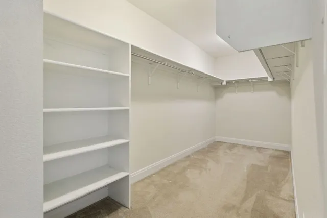 a view of an empty walk in closet