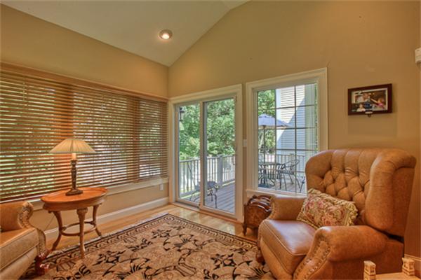 4 Coppersmyth Way, Unit 4 Lexington, MA 02421 - Photo 11 of 28 a living room with furniture and a window
