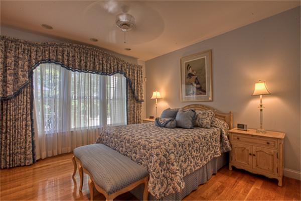 4 Coppersmyth Way, Unit 4 Lexington, MA 02421 - Photo 12 of 28 a bedroom with a bed and a dresser