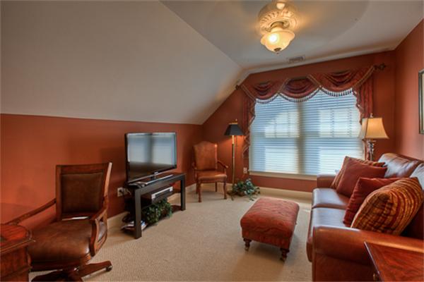 4 Coppersmyth Way, Unit 4 Lexington, MA 02421 - Photo 21 of 28 a projector room with furniture and a flat screen tv