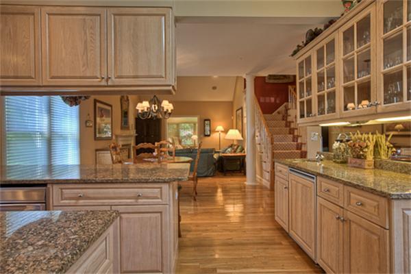 4 Coppersmyth Way, Unit 4 Lexington, MA 02421 - Photo 4 of 28 a kitchen with stainless steel appliances granite countertop a stove and cabinets
