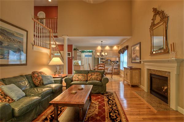 4 Coppersmyth Way, Unit 4 Lexington, MA 02421 - Photo 10 of 28 a living room with furniture and a fireplace
