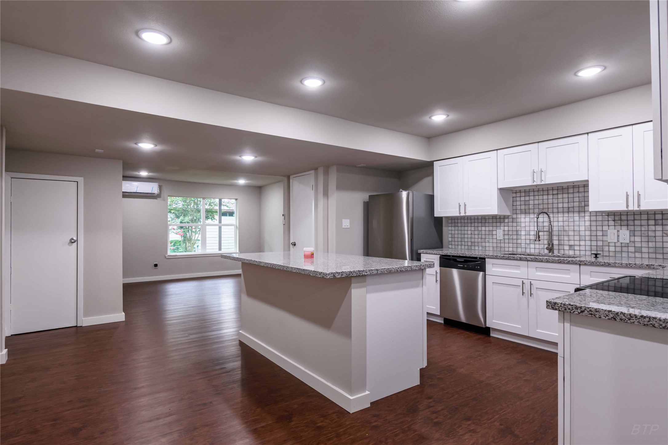 11933 Beechnut Street Houston, TX 77072 - Photo 5 of 9 a large kitchen with stainless steel appliances granite countertop a stove and a sink