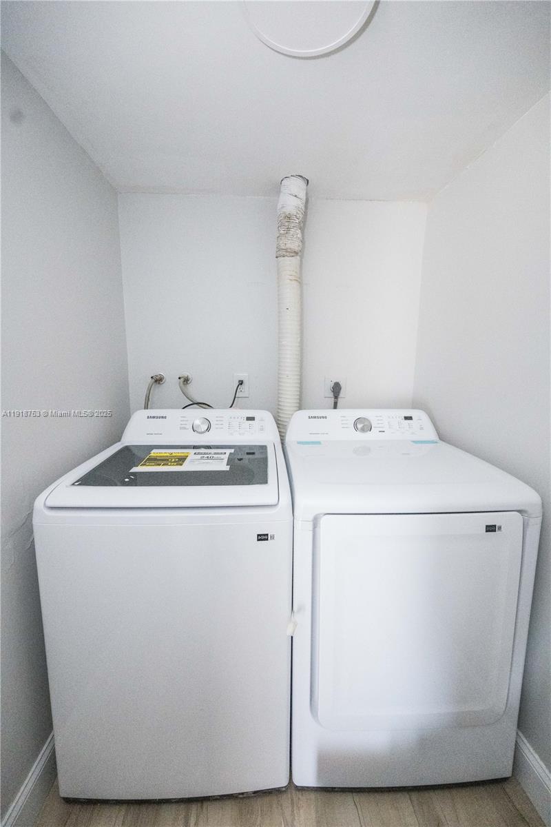 755 Dotterel Road, Unit 1301 Delray Beach, FL 33444 - Photo 15 of 15 a utility room with dryer and washer