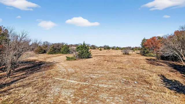 a view of lake with green space