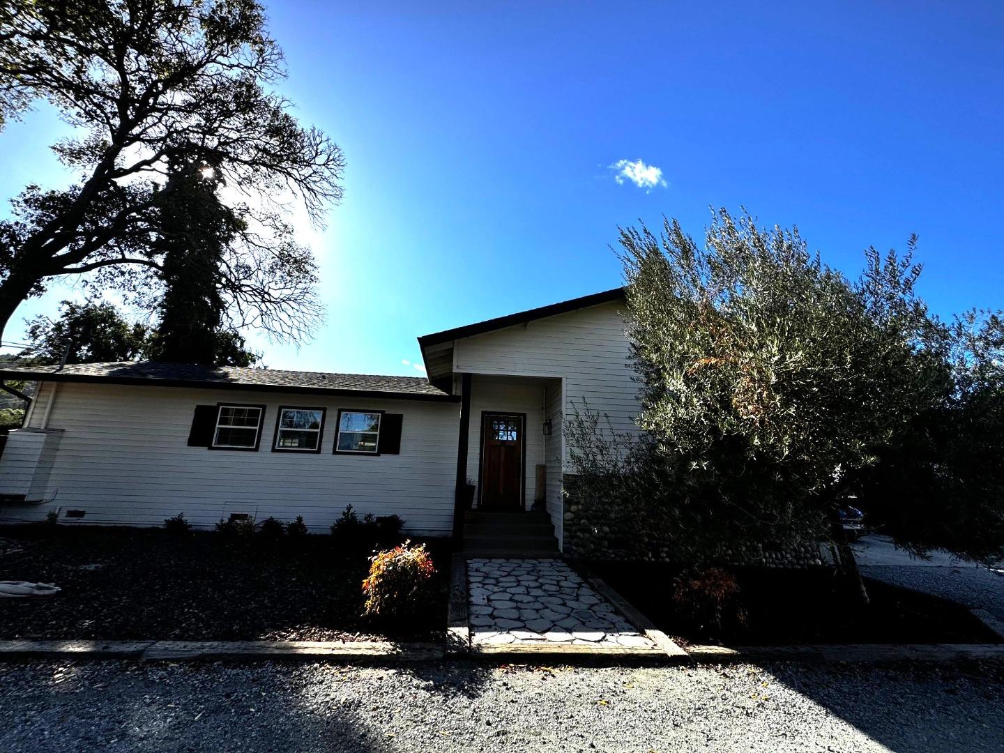 a front view of a house with garden