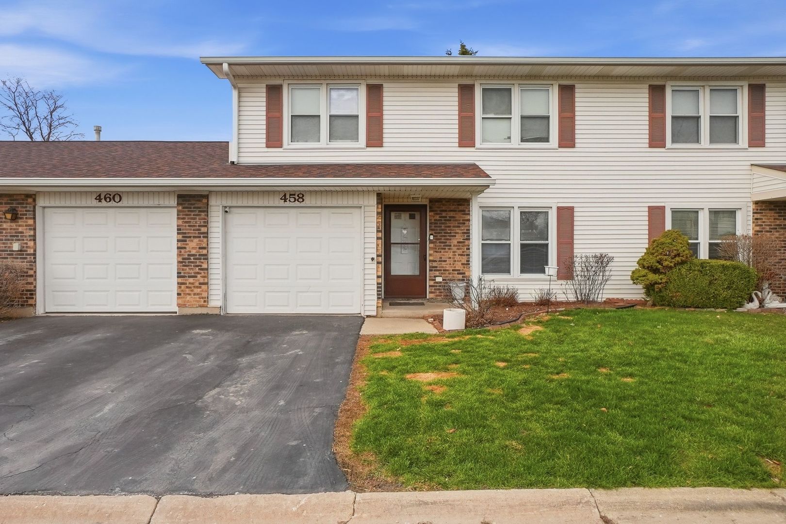 458 Wyeth Court Bolingbrook, IL 60440 - Photo 1 of 17 a front view of a house with garden