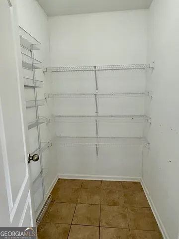 an empty room with closet area
