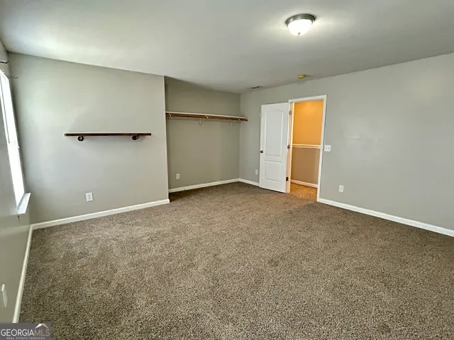 a view of a hallway with a window