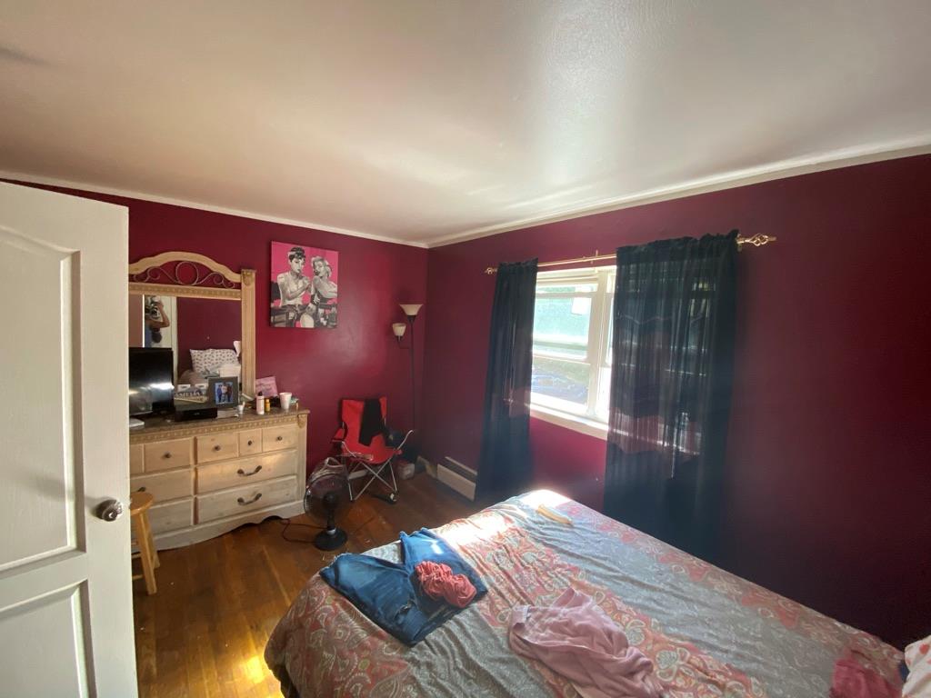 34 Columbus Avenue, Unit B20 Spring Valley, NY 10977 - Photo 7 of 10 Bedroom featuring wood finished floors and ornamental molding