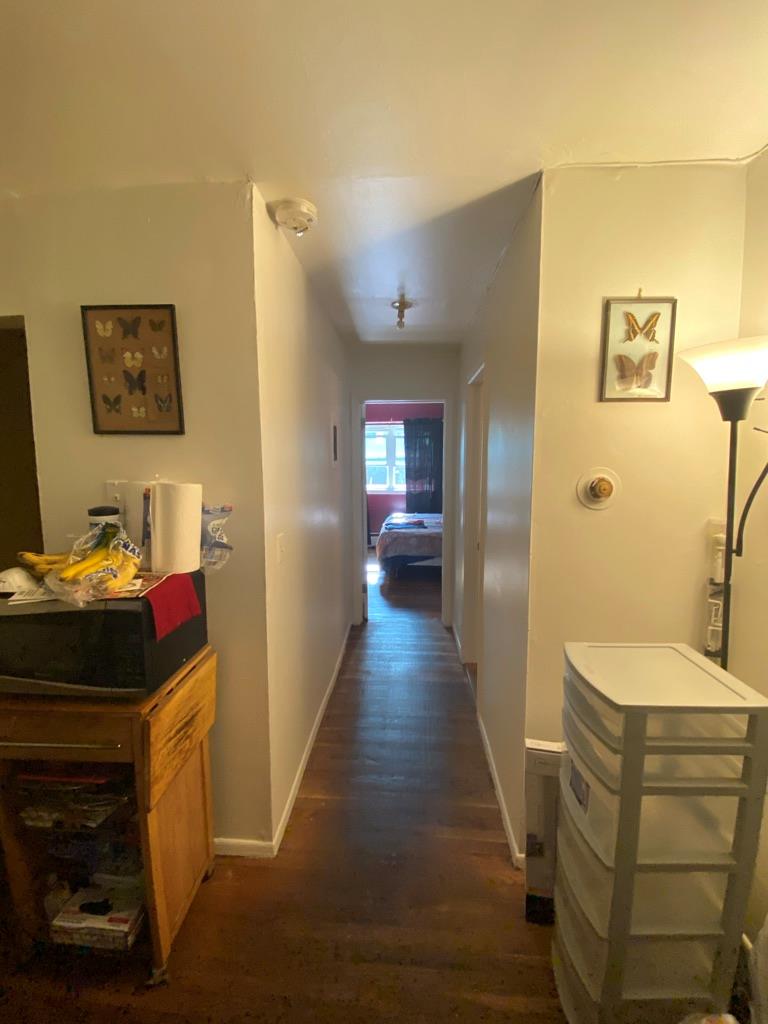 34 Columbus Avenue, Unit B20 Spring Valley, NY 10977 - Photo 9 of 10 Hall featuring dark wood-style flooring and baseboards