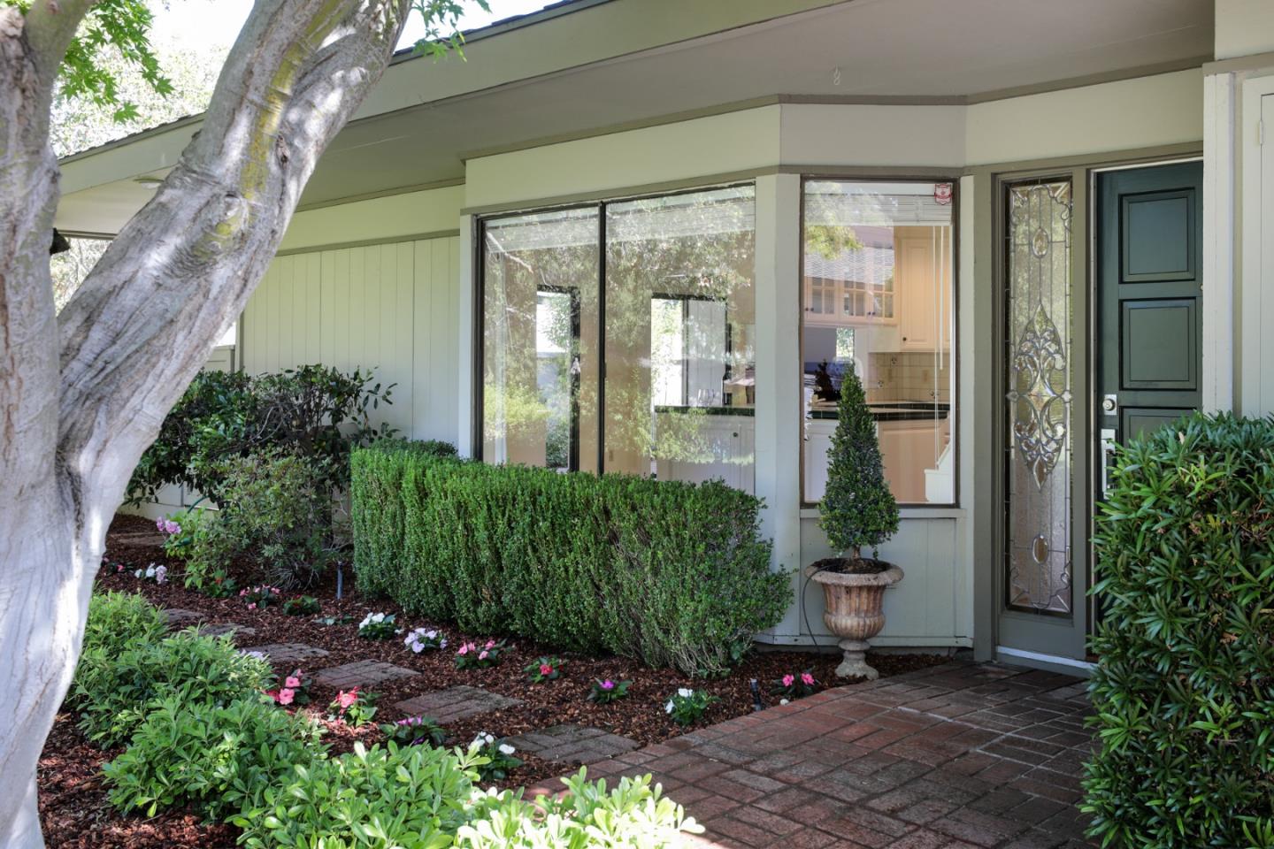 47 Bay Tree Lane Los Altos, CA 94022 - Photo 1 of 34 a front view of a house with a yard