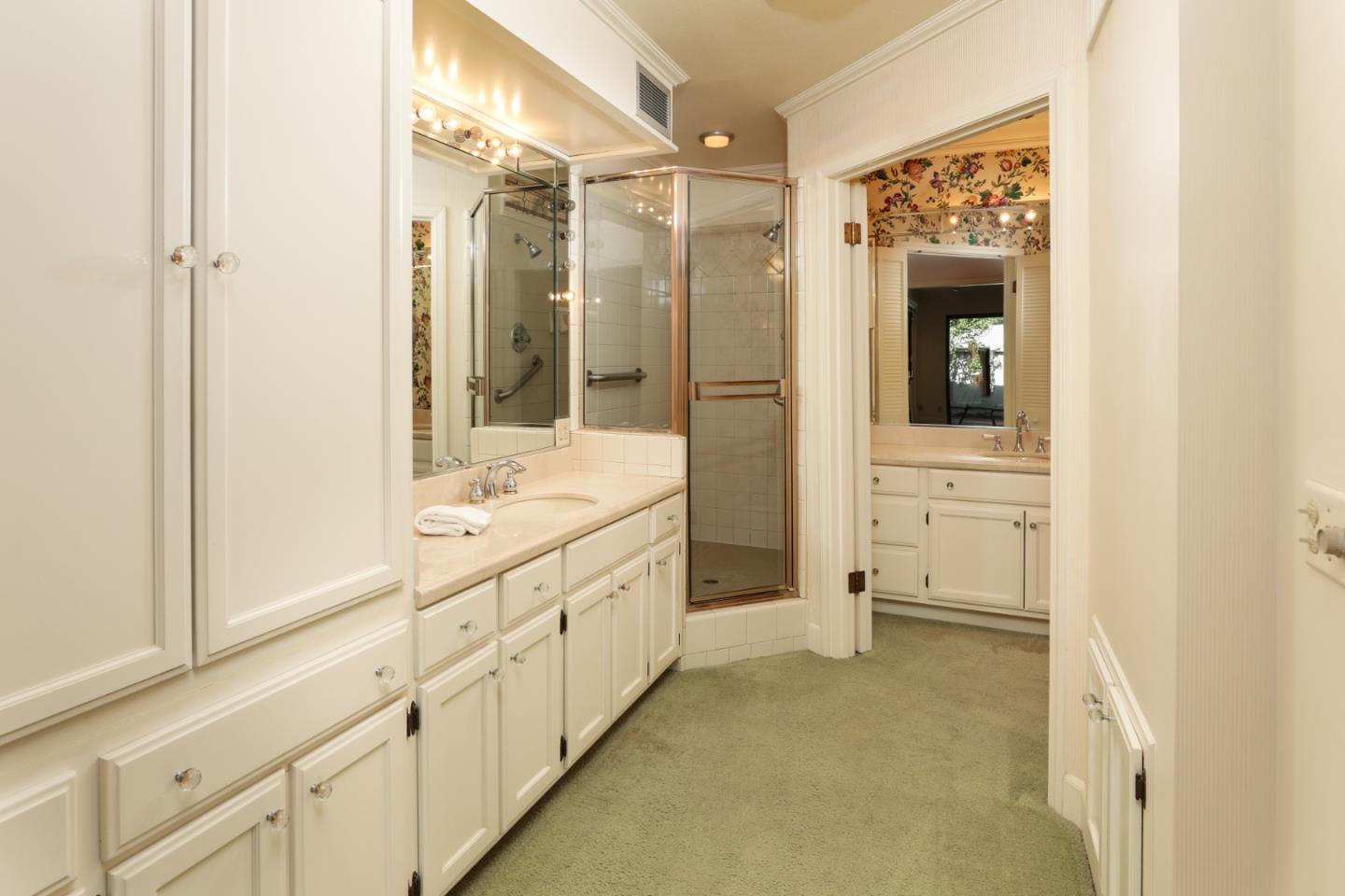 47 Bay Tree Lane Los Altos, CA 94022 - Photo 16 of 34 a bathroom with a shower sink and mirror