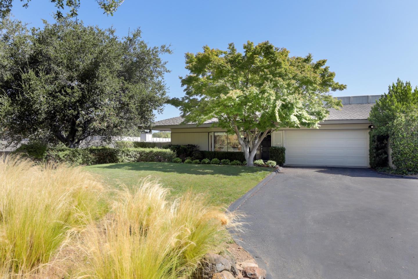 47 Bay Tree Lane Los Altos, CA 94022 - Photo 2 of 34 a front view of a house with a yard and garage