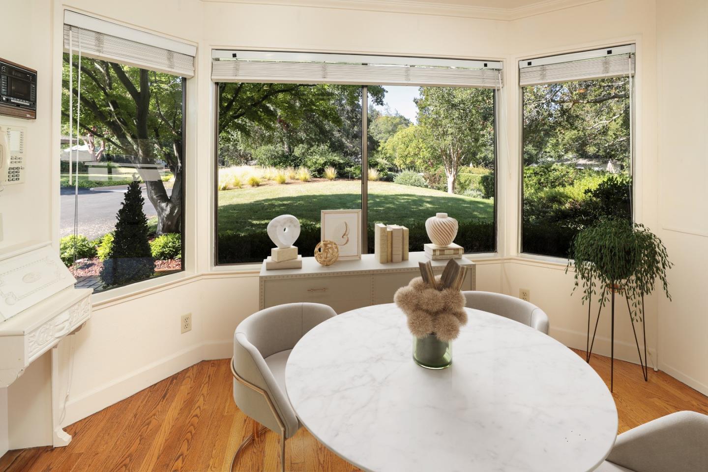 47 Bay Tree Lane Los Altos, CA 94022 - Photo 7 of 34 a dining room with glass windows table and chairs
