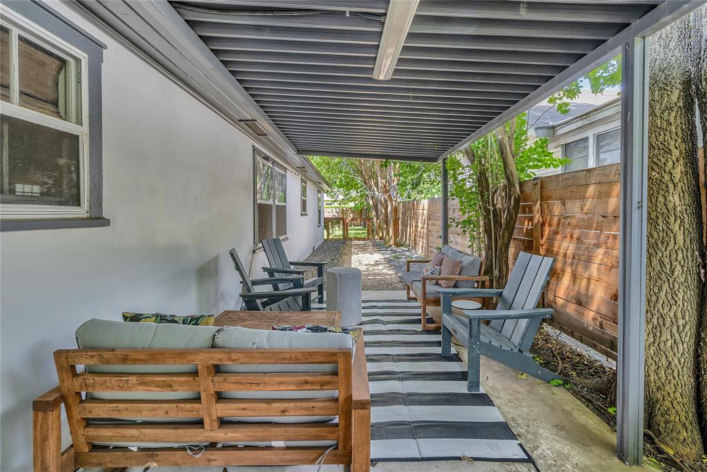 2523 McKenzie Avenue Waco, TX 76708 - Photo 35 of 40 Covered patio area featuring a slatted roof and concrete slab flooring