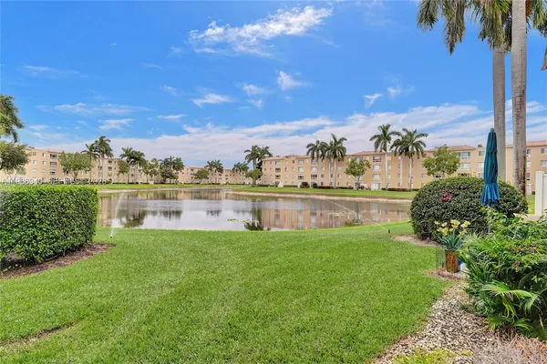 a view of a lake with a big yard