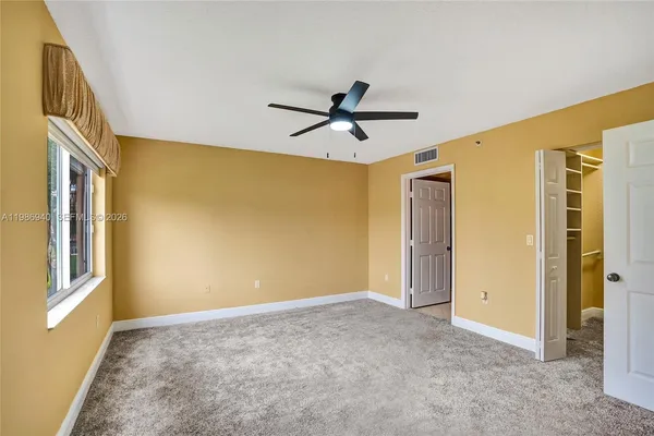 a view of an empty room with a window