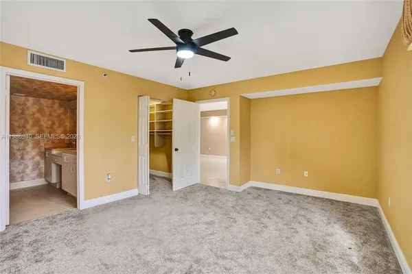 a view of closet area with empty racks