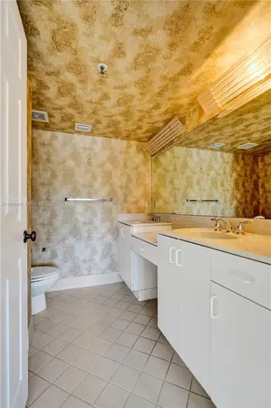a bathroom with a tub shower and sink