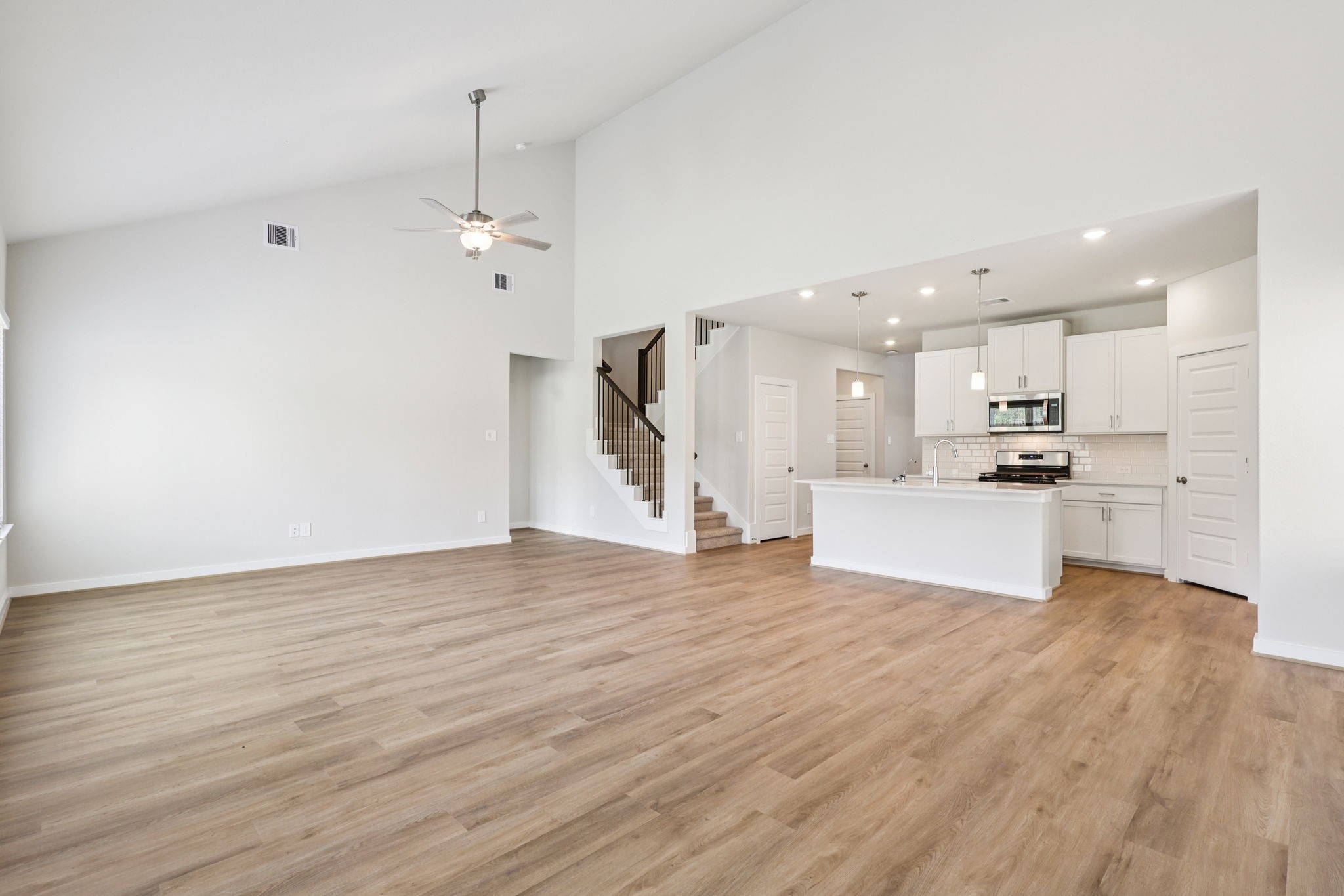 5223 Kingdom Heights Boulevard Rosenberg, TX 77471 - Photo 11 of 41 a view of kitchen with wooden floor and window