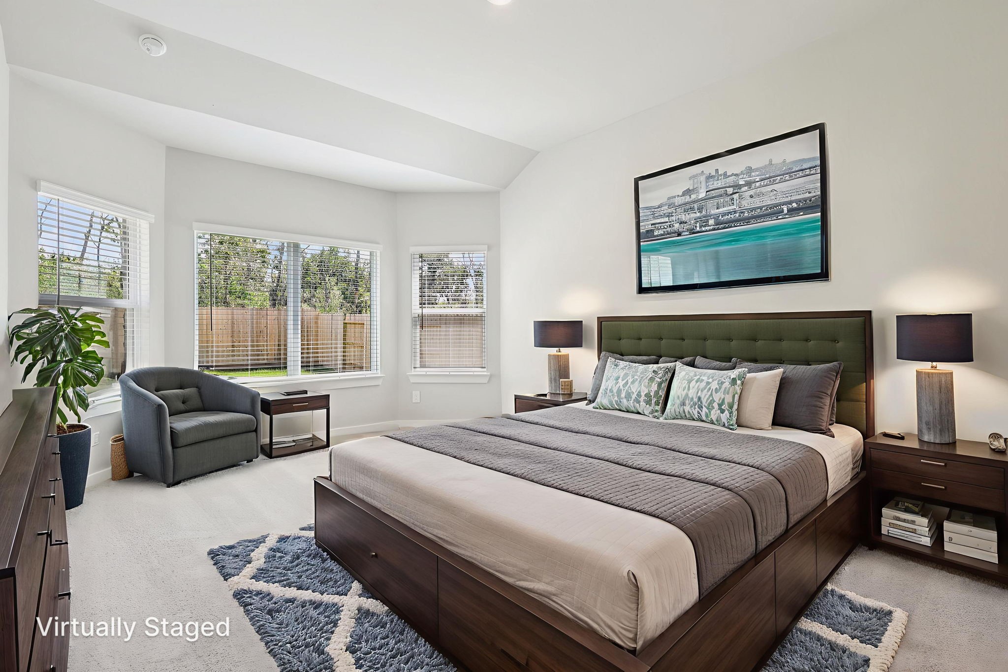 5223 Kingdom Heights Boulevard Rosenberg, TX 77471 - Photo 17 of 41 a bedroom with a bed couch and windows