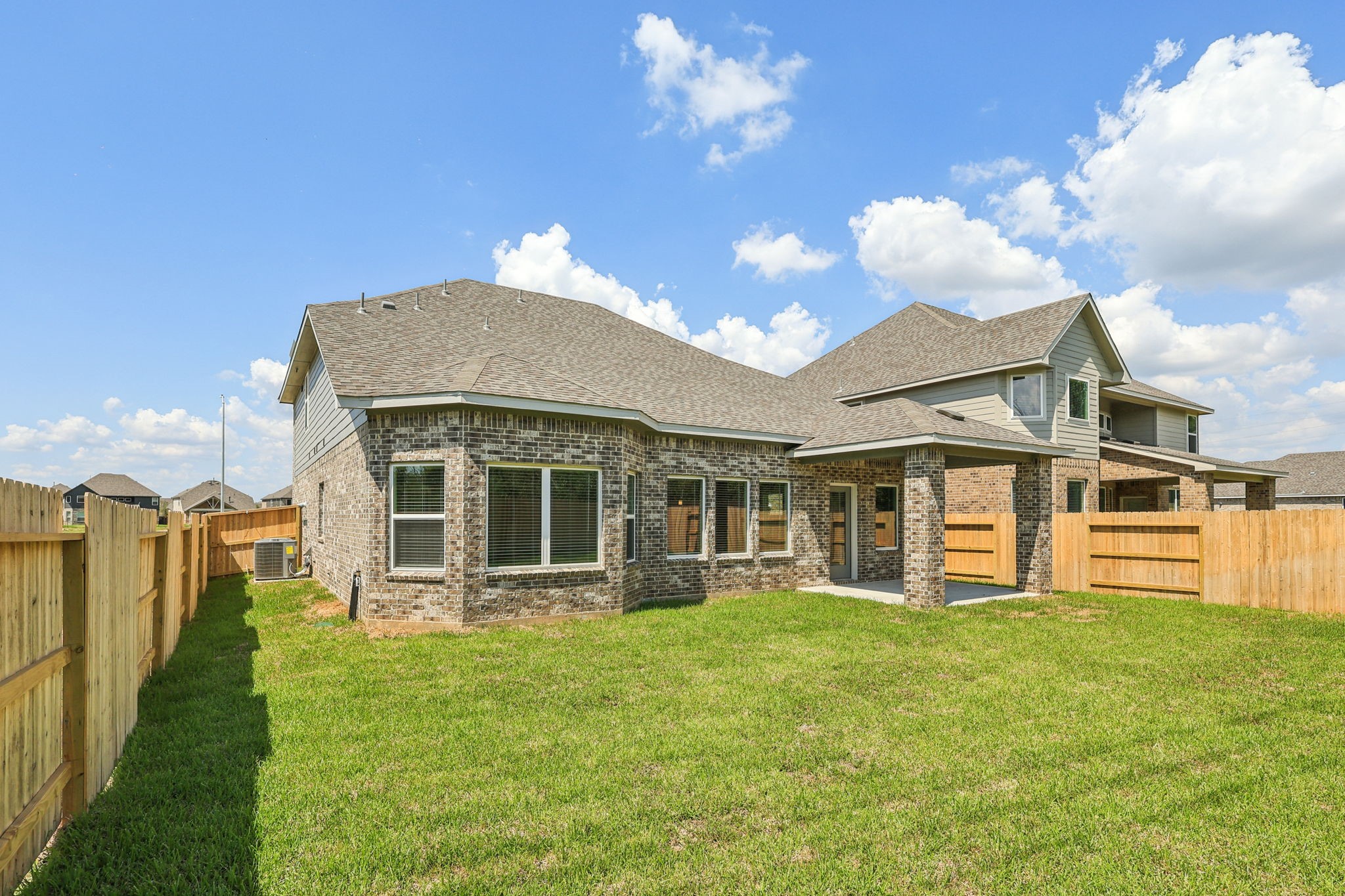 5223 Kingdom Heights Boulevard Rosenberg, TX 77471 - Photo 39 of 41 a view of a house with a yard and potted plants