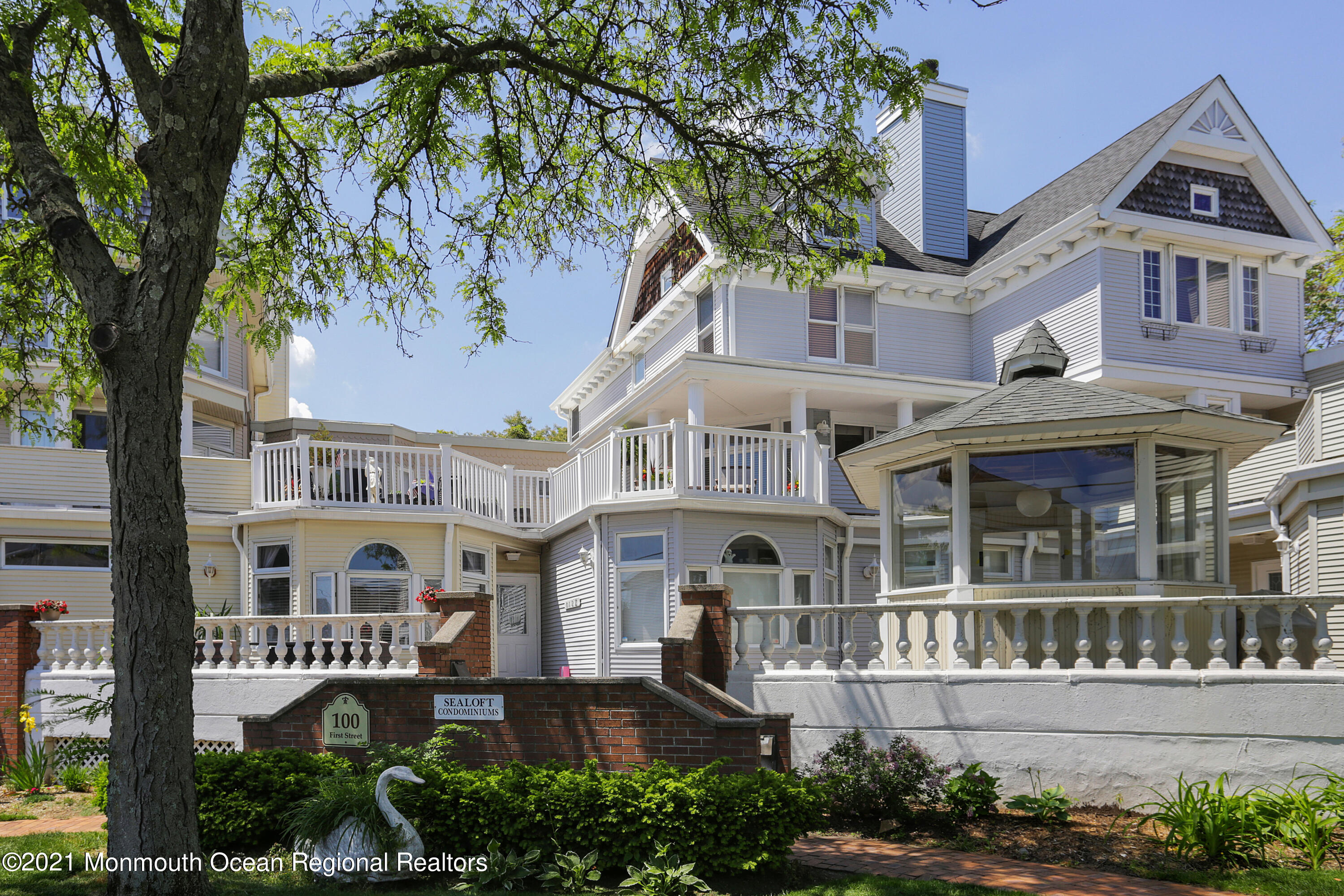 a front view of a residential apartment building with a yard