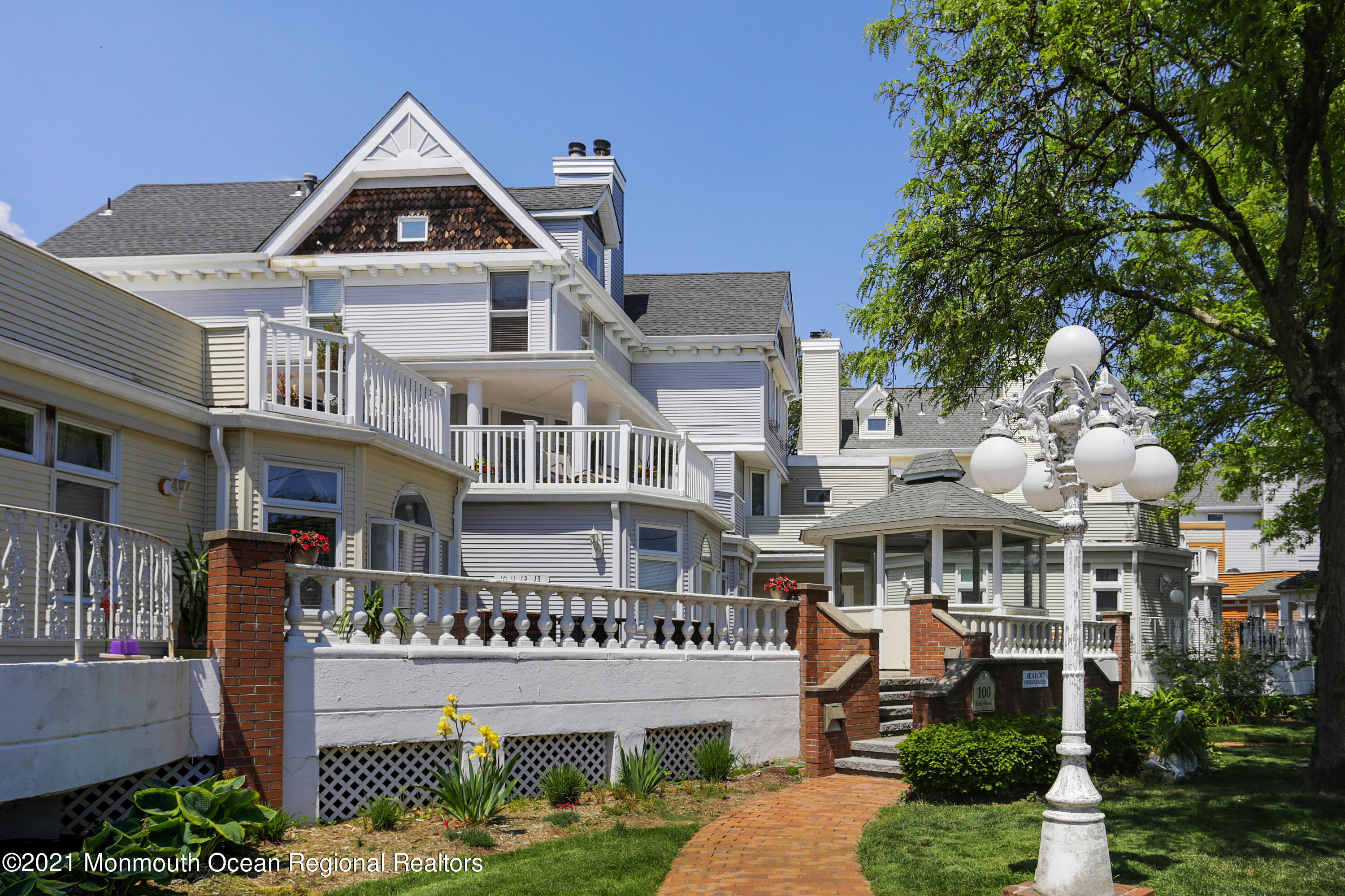 100 1st Street, Unit 11 Keyport, NJ 07735 - Photo 2 of 29 a front view of a residential apartment building with a yard