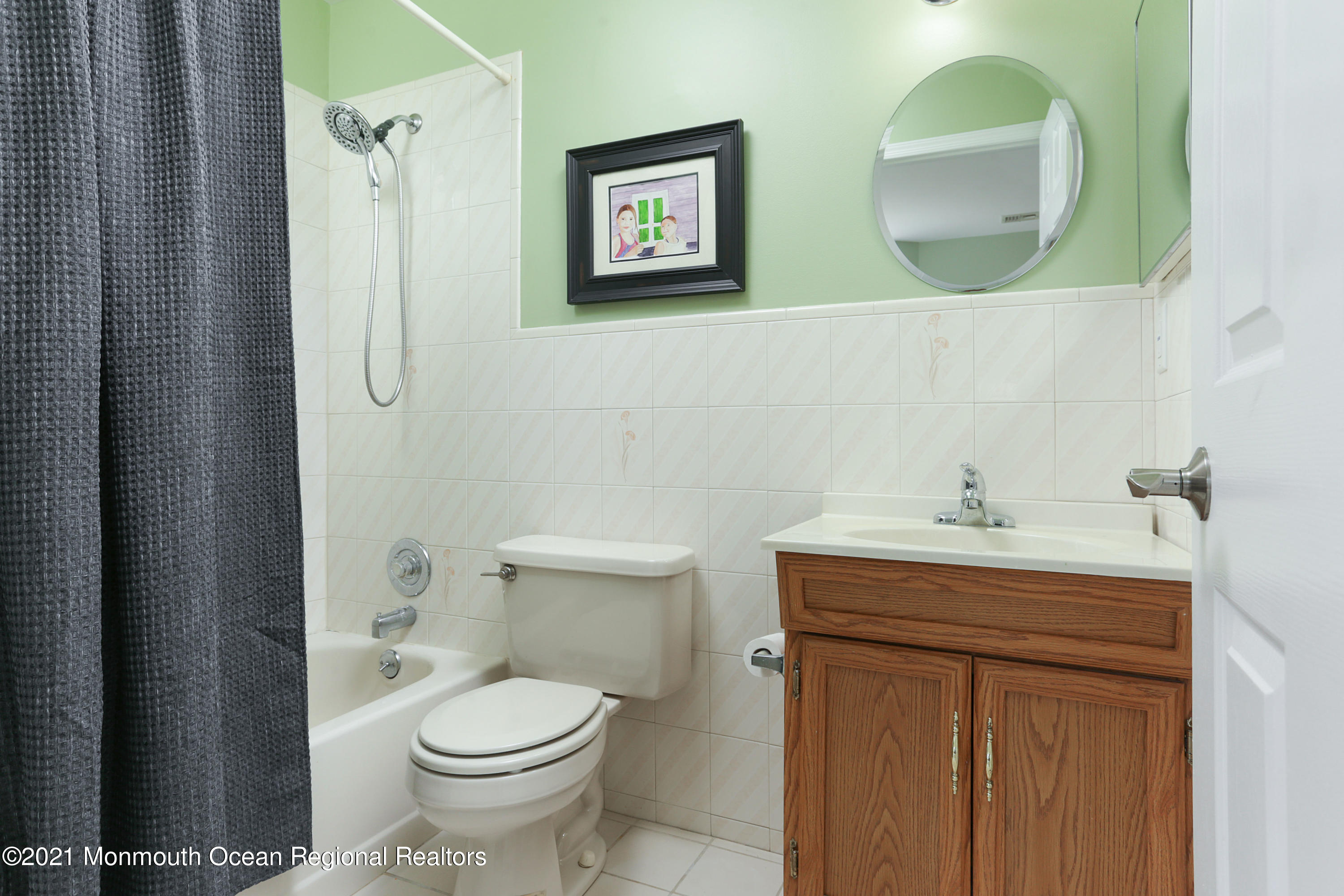 100 1st Street, Unit 11 Keyport, NJ 07735 - Photo 17 of 29 a bathroom with a toilet sink and mirror