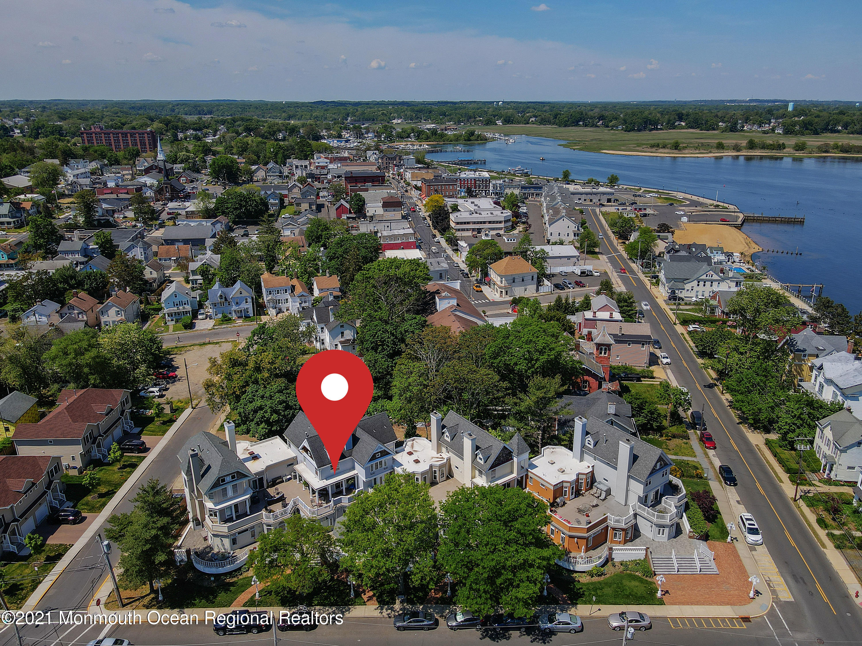 100 1st Street, Unit 11 Keyport, NJ 07735 - Photo 18 of 29 an aerial view of residential houses with outdoor space and lake view