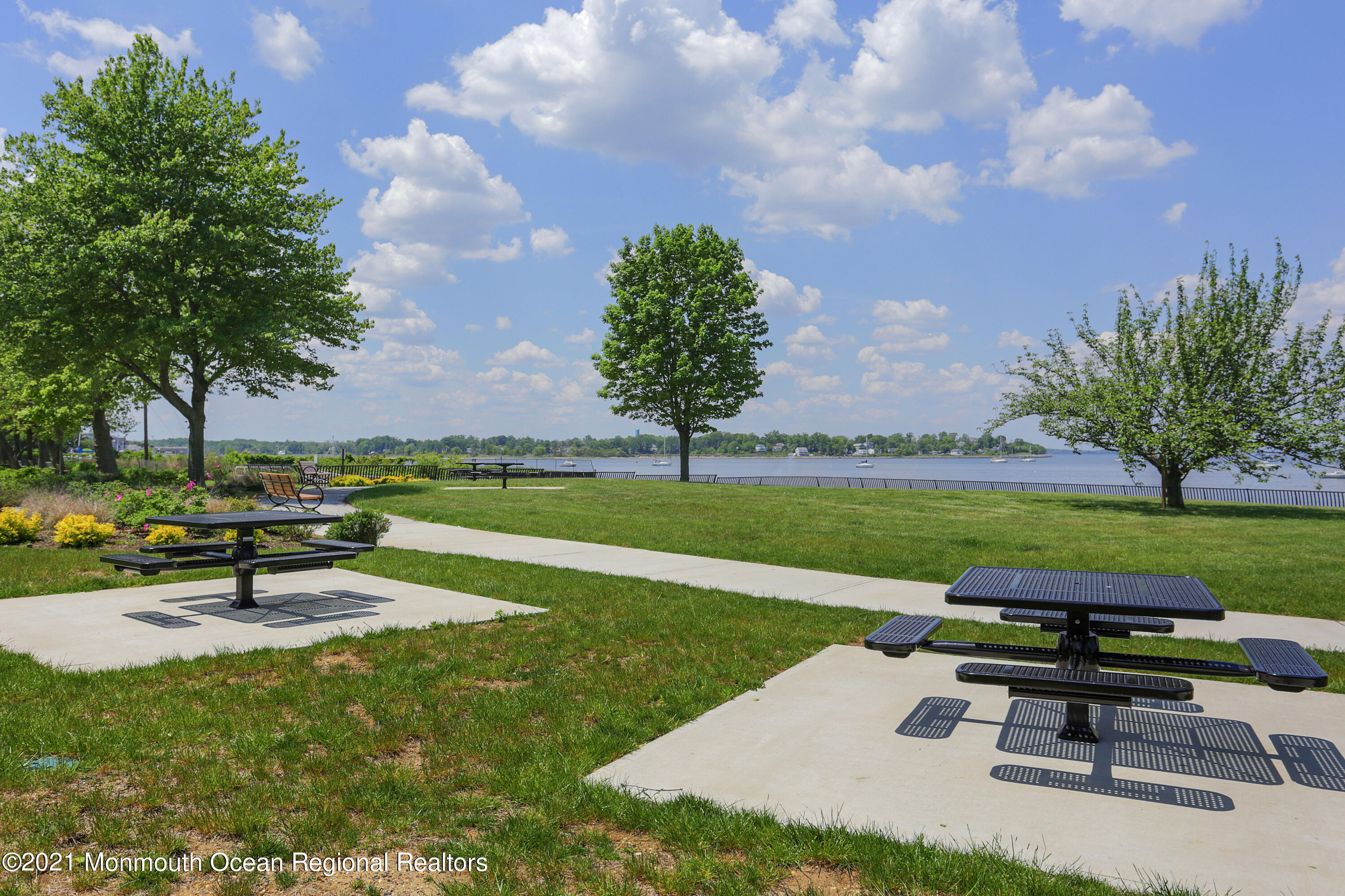 100 1st Street, Unit 11 Keyport, NJ 07735 - Photo 28 of 29 a swimming pool with outdoor seating and garden