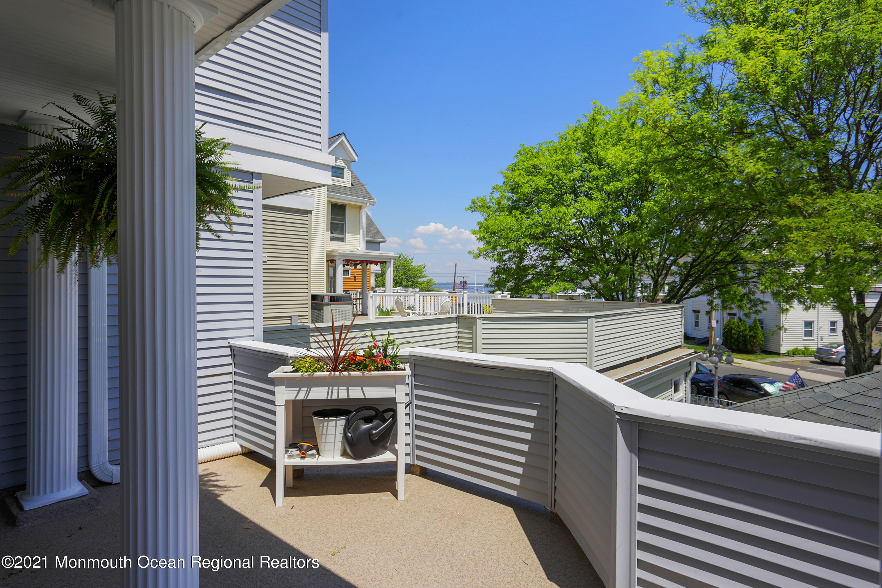 100 1st Street, Unit 11 Keyport, NJ 07735 - Photo 4 of 29 a view of outdoor sitting area with furniture and wooden fence