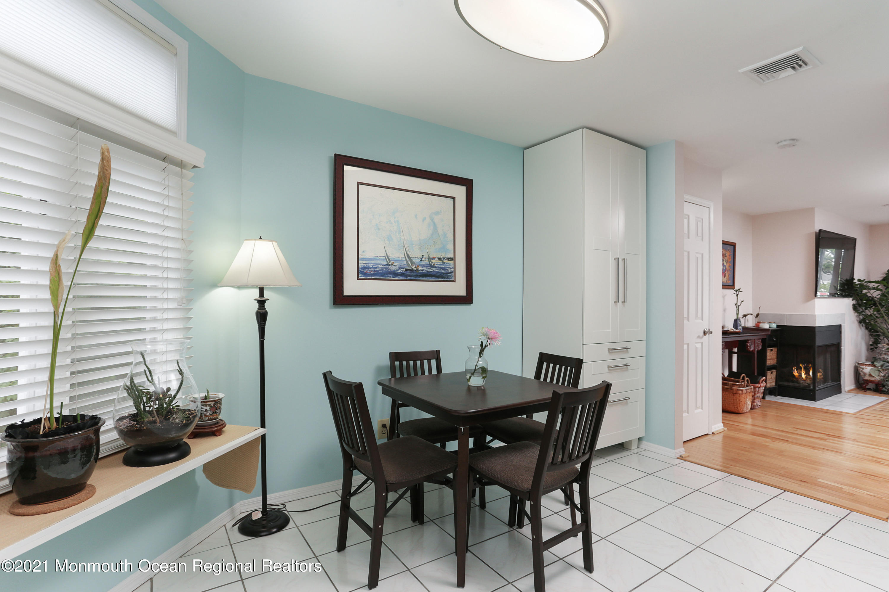 100 1st Street, Unit 11 Keyport, NJ 07735 - Photo 8 of 29 a view of a dining room with furniture and chandelier