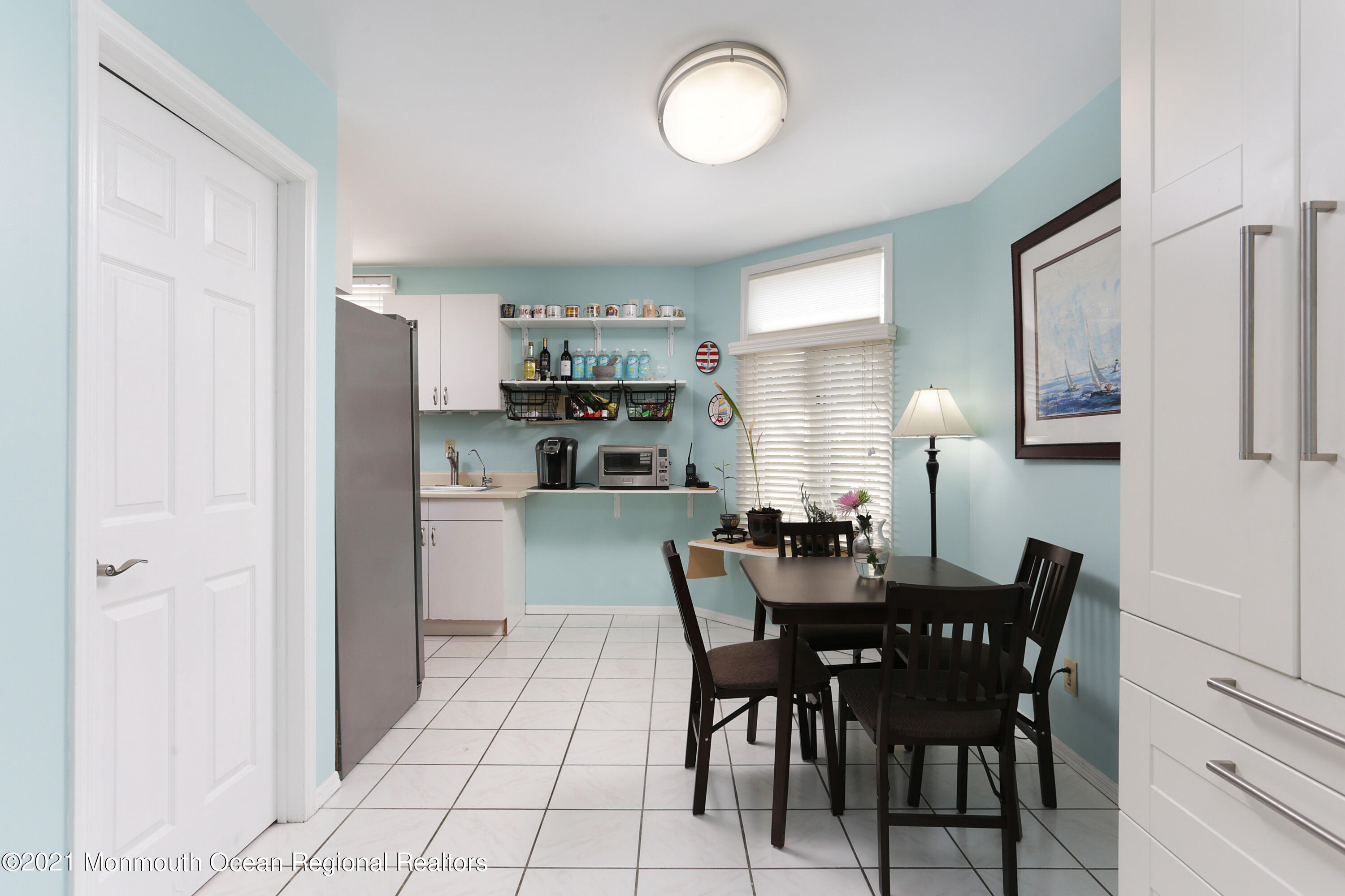 100 1st Street, Unit 11 Keyport, NJ 07735 - Photo 10 of 29 a view of a dining room with furniture and wooden floor