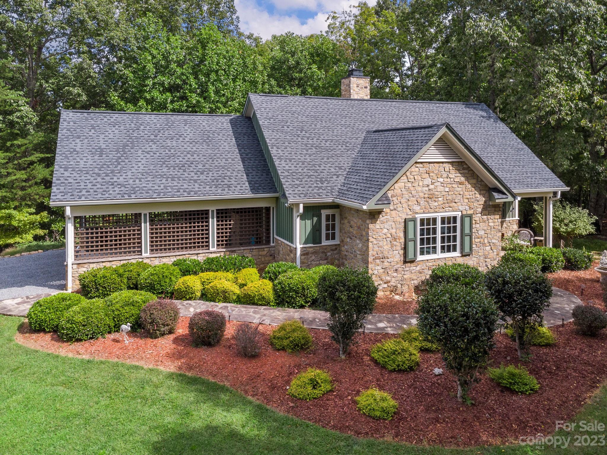 795 Golden Road Tryon, NC 28782 - Photo 3 of 32 a aerial view of a house with yard and green space