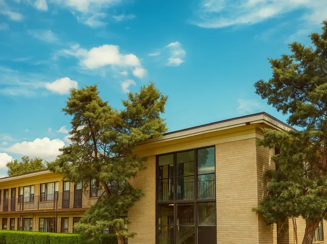 a view of a house with a tree